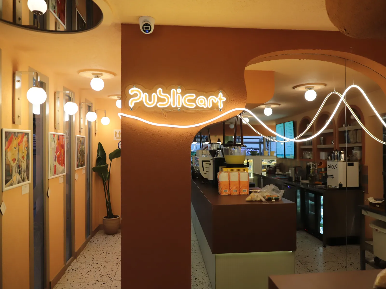 Inside Public Art Kuşadası: the art wall, neon sign and bar